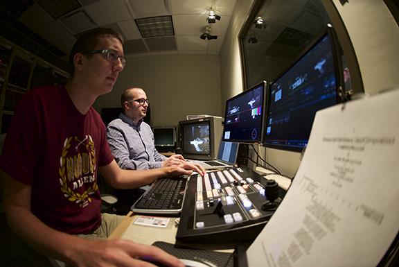 Greg Smith (left) and Steven Cohen work in the control booth at NET during a live webcast of a DMA recital of Masayoshi Ishikawa in Westbrook Recital Hall.