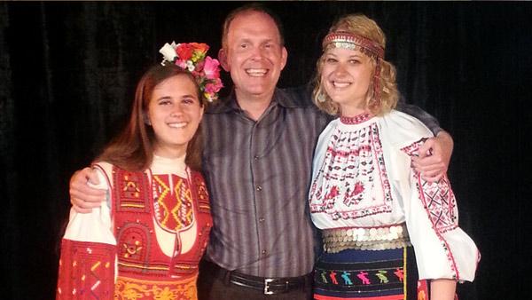 Professor of Piano Mark Clinton with UNL students Emily Callahan (left) and Jennifer Weier after the final concert of the International Chamber Music Festival, when many of the students were dressed in traditional Bulgarian clothing.